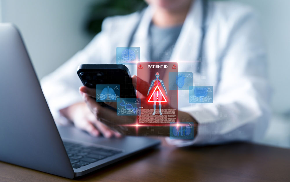Doctor holding smart phone with security alert icon displaying